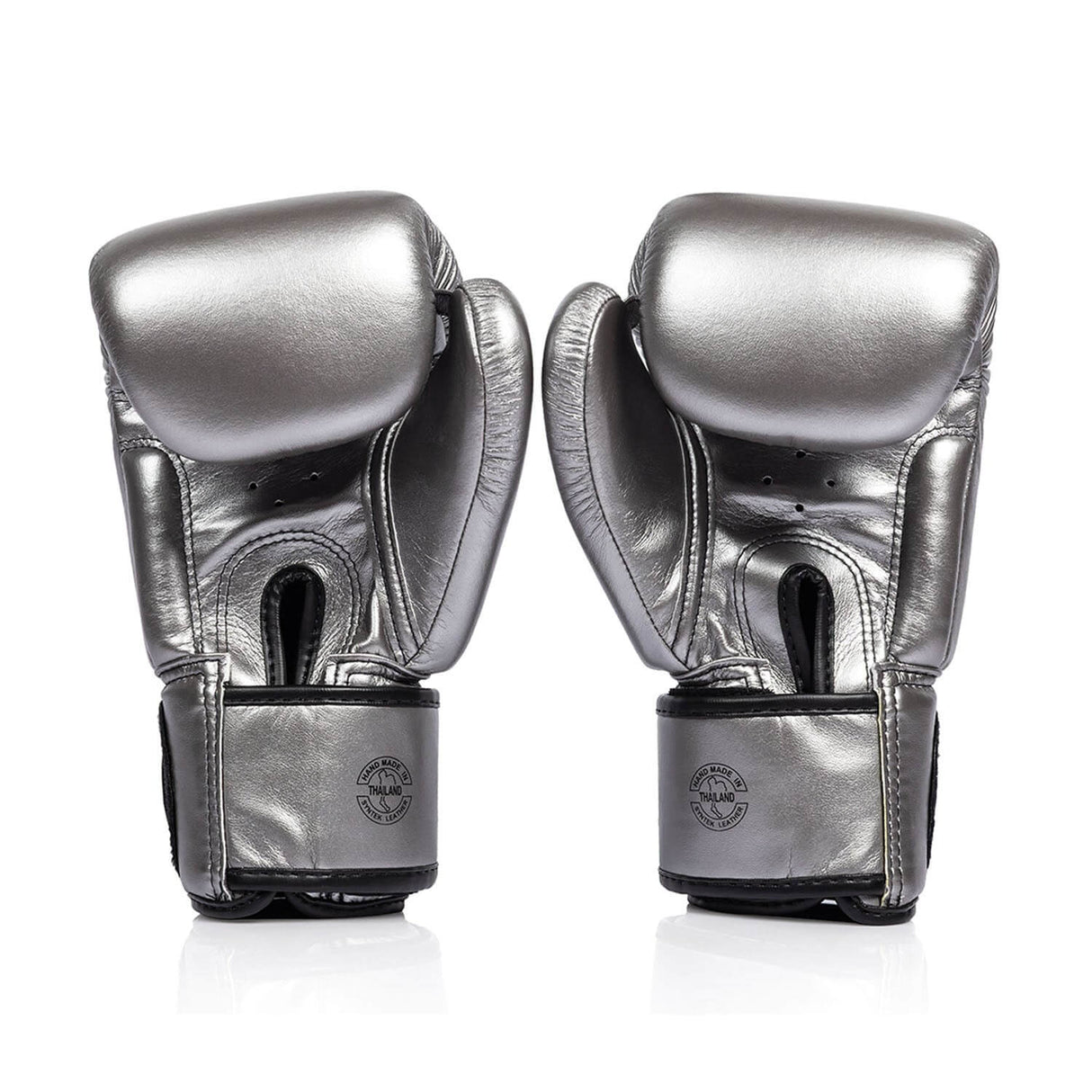 Pair of silver and black fairtex bgv1c plus microfibre boxing gloves on a white background back view of velcro closure