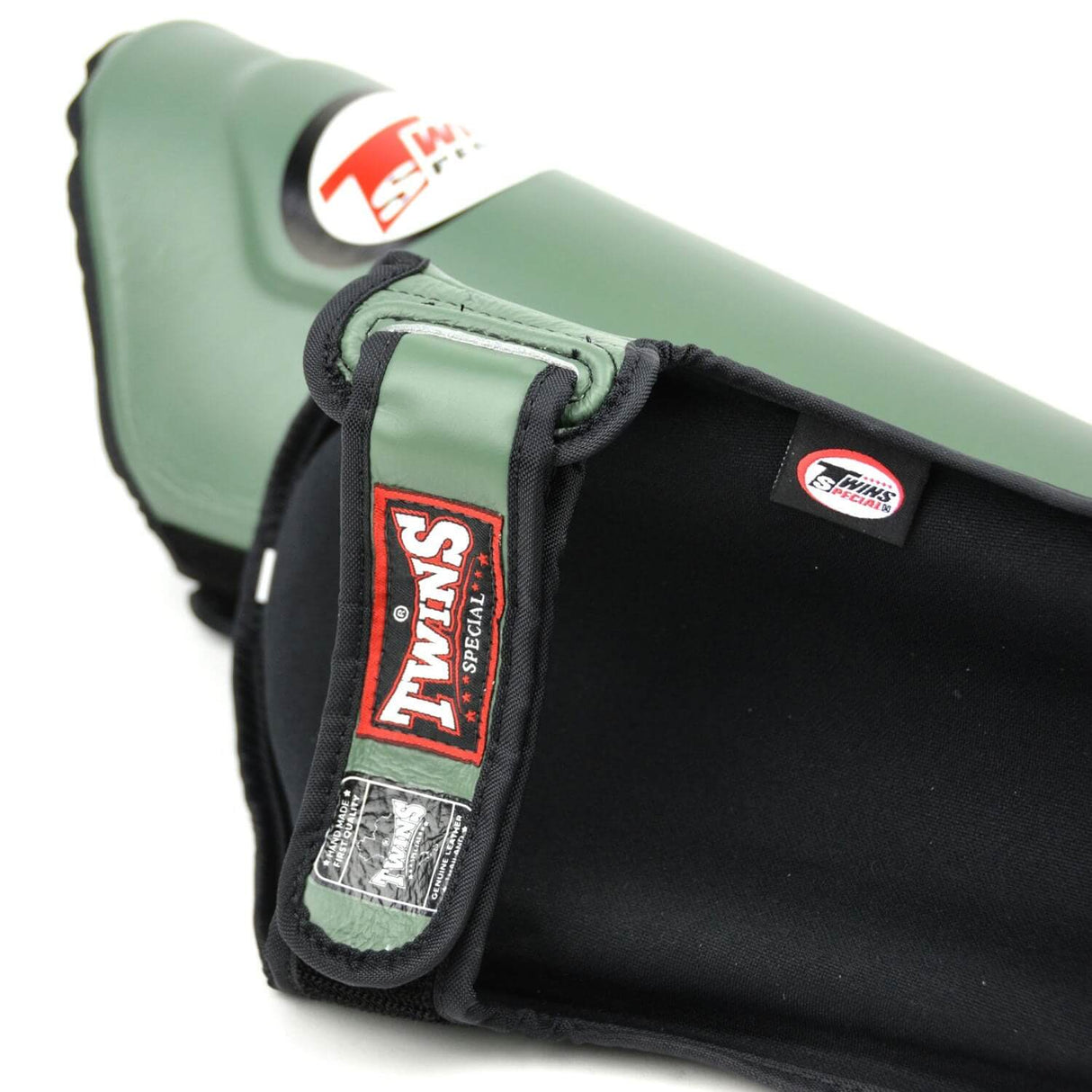 Close-up of a green and black protective pad Twins Special Leather Shinguards SGL10