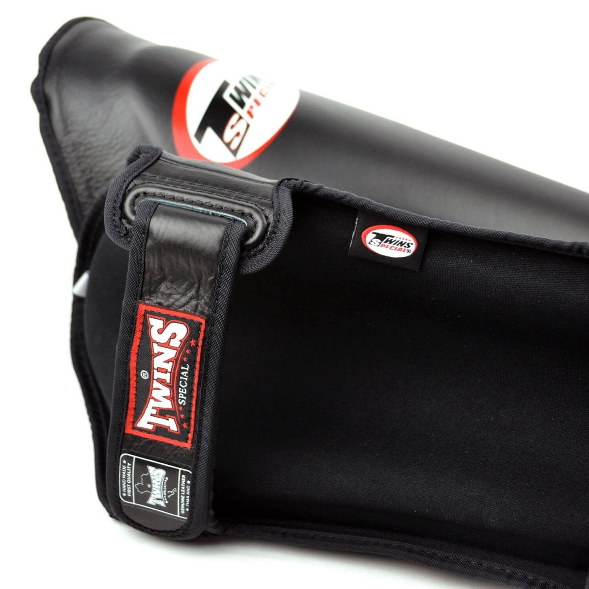 Close up of Twins Special sgl10 shin guards in black with adjustable velcro closure