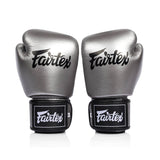 Pair of silver and black fairtex bgv1c plus microfibre boxing gloves on a white background front view