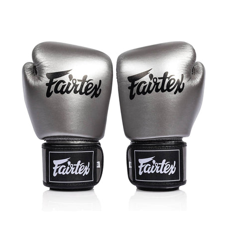 Pair of silver and black fairtex bgv1c plus microfibre boxing gloves on a white background front view