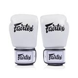 Pair of white Fairtex bgv1c plusboxing gloves on a white background