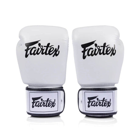 Pair of white Fairtex bgv1c plusboxing gloves on a white background