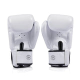 Pair of white Fairtex bgv1c plus boxing gloves with black accents on a white background