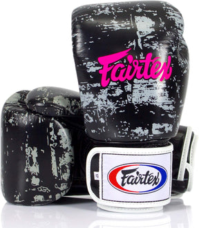 A pair of Fairtex BGV1 Universal Boxing Gloves in a dark cloud color with pink and white Fairtex logo on the wrist strap.